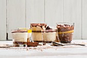 Six different desserts in glasses