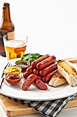 Sausages with grilled bread, sauces and beer