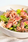 Baby octopus with green peas and fresh mint