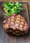 Grilled beef steak on a wooden board