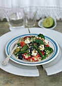 Greek salad with green beans, broccoli, tomatoes, bulgur and olives