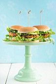 Veggie burgers with lentil patties on a cake stand