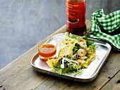 Omelette with salad, prawns and chilli sauce