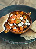 Carrot salad with sheep's cheese and unleavened bread
