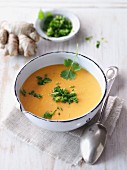 Carrot and ginger soup with herbs