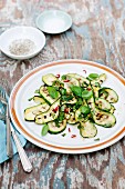 Grilled courgette strips with a chilli, lemon and mint dressing and basil leaves