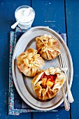 Pancake parcels with chicken, pepper and pineapple served with garlic sauce