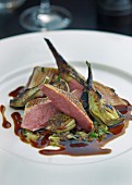 Fried pigeon breast with artichokes and beer gravy