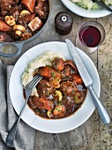 Beef ragout with carrots, mushrooms and mashed potato