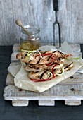 Grilled chicken breast in a spicy salad marinade