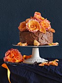 A chocolate ganache cake decorated with roses