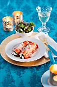 Lasagne rolls with ricotta, spinach and tomato sauce for Christmas