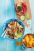 Chicken salad with kidney beans, cherry tomatoes and limes (Mexico)