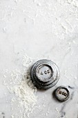 Weights on a floured marble surface