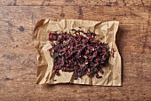 Dried flower petals on a piece of crumpled paper