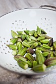 Fresh okra in a colander