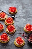 Plum tartlets with rose and cardamom syrup