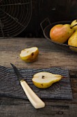 A halved pear on a wooden table