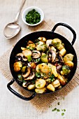 Fried potatoes with Brussels sprouts and mushrooms