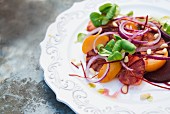Blood orange salad with red onions and pine nuts