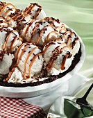 Ice cream pie with chocolate sprinkles and caramel sauce