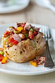 Baked potatoes with tuna fish and a bean salsa