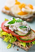 Crispbread topped with lettuce, cucumber, tomatoes and cottage cheese