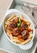 Penne pasta with lamb meatball and tomato sauce
