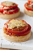 Pizza crumpets with tomatoes and cheese