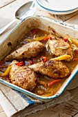 Roast chicken breast with red and yellow peppers