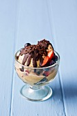 Chocolate and caramel ice cream with berries