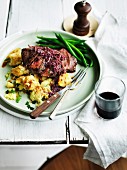 Flat-iron steak with red wine, ginger sauce and crushed potatoes