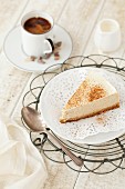 A slice of spiced cheesecake with coffee