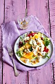 Persimmon salad with gorgonzola, walnuts and a honey and mustard dressing