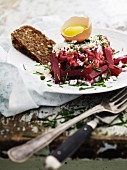Beef tatar with beetroot, egg and wholemeal bread