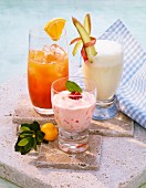 A rhubarb shake, an iced raspberry shake and a spring shake made with orange juice