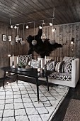 Dark, cosy living room with ethnic accessories