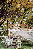 Festively set table in autumnal garden