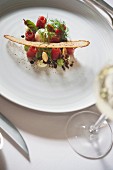 A dish by TV chef Frank Buchholz: marinated beef with a poached quail's egg