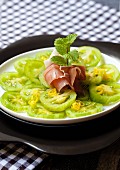 Green tomato carpaccio with lemons, mint and Parma ham