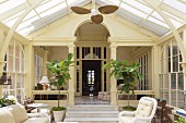 Wicker furniture in Art Nouveau conservatory of classic villa