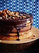 Triple layer chocolate and caramel cake with walnuts
