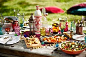 A Moroccan summer party with various dishes on a garden table