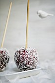 Toffee apples sprinkled with coconut