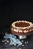 Chocolate cheesecake with caramel, peanuts and ganache