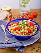 Chickpea salad with tomato and spring onions