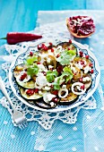 Courgette salad with feta cheese and pomegranate seeds