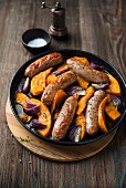 Sausages with pumpkin and onions