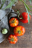 Fresh tomatoes on a rustic wooden table