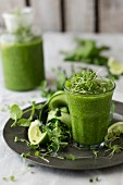 A green smoothie with cucumber, cress and limes